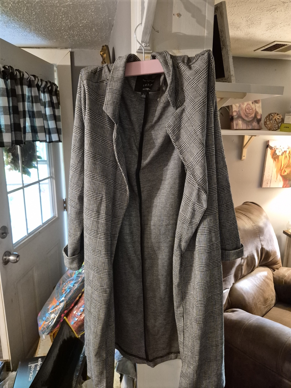 Iris brand long coat features a classic black and white plaid pattern and a mode